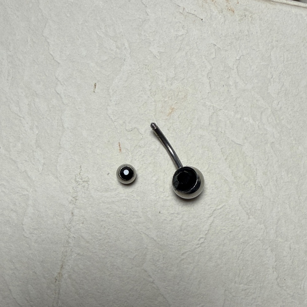 Brand new. Black and Silver belly button Ring Set